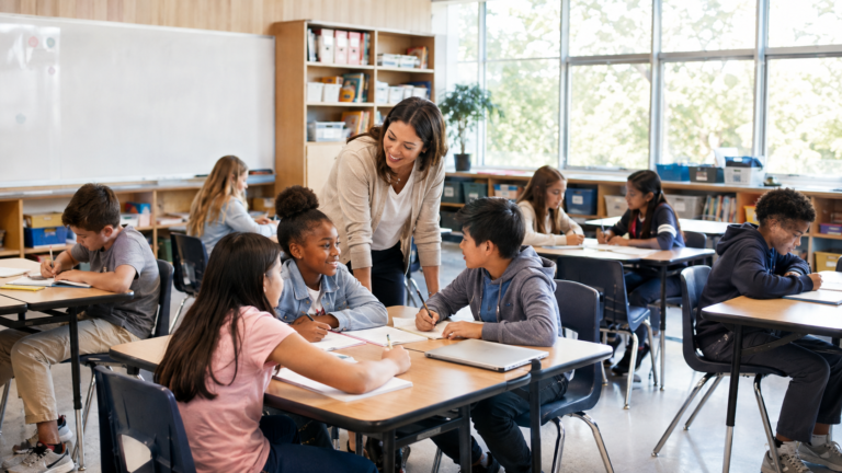 Teacher supporting students using different instructional strategies in the classroom